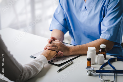 doctor holding patient's hand Cheer and encourage while checking your health. Trust your health and mind.