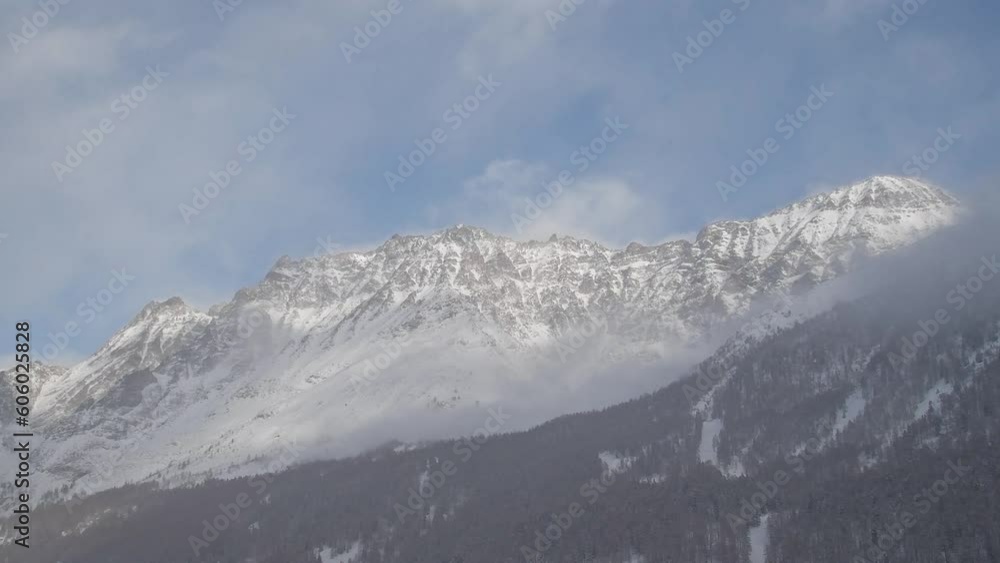 Alps mountains with clouds in the winter season Alps mountains with clouds in the winter season