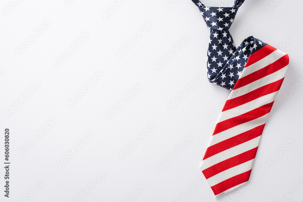 Celebratory items viewed from the top: necktie with USA flag pattern isolated on white background with space for text or advertising Celebratory items viewed from the top: necktie with USA flag pattern isolated on white background with space for text or advertising