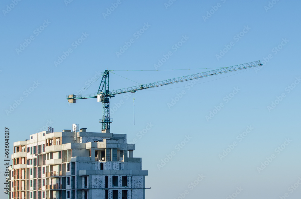 Fototapeta premium Construction site, tower crane on sky background