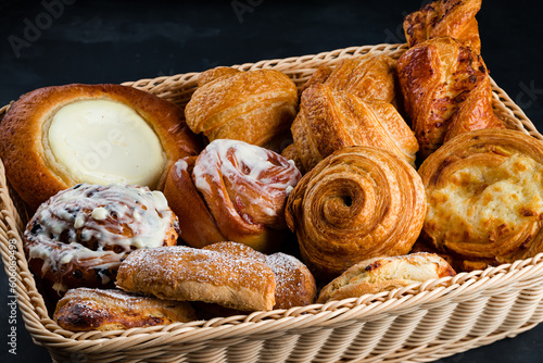 Fresh pastries: croissants, rolls, puffs and bun with sour cream.