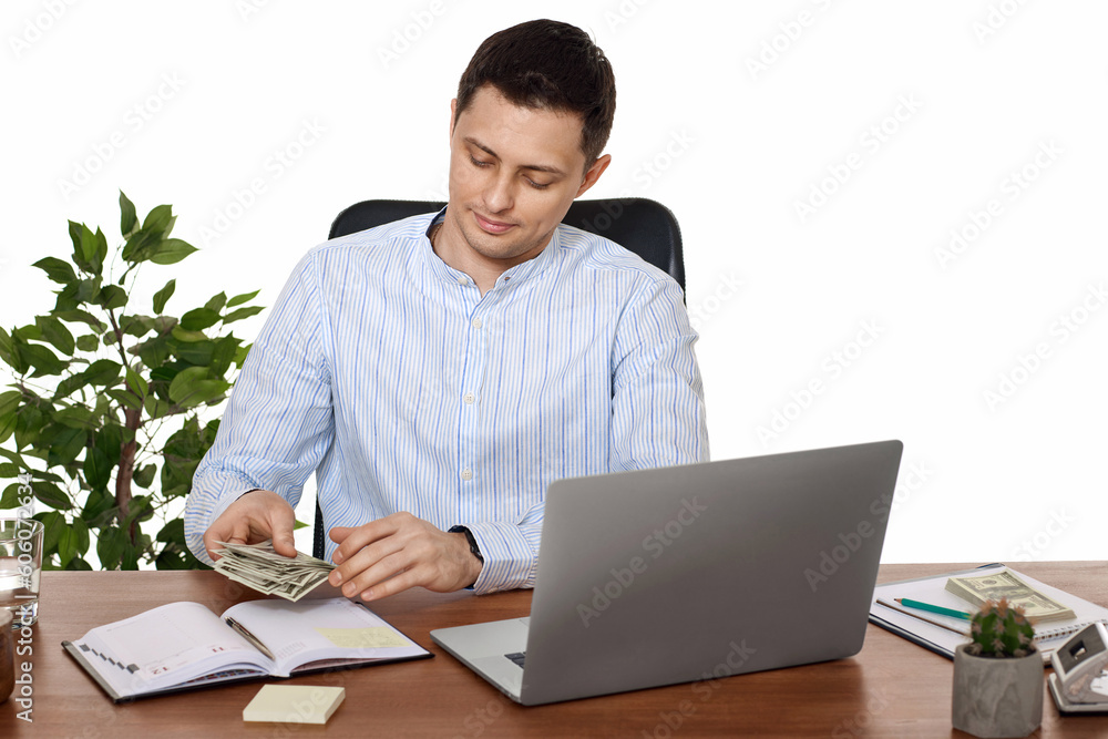 handsome businessman working on laptop and holding money handsome businessman working on laptop and holding money