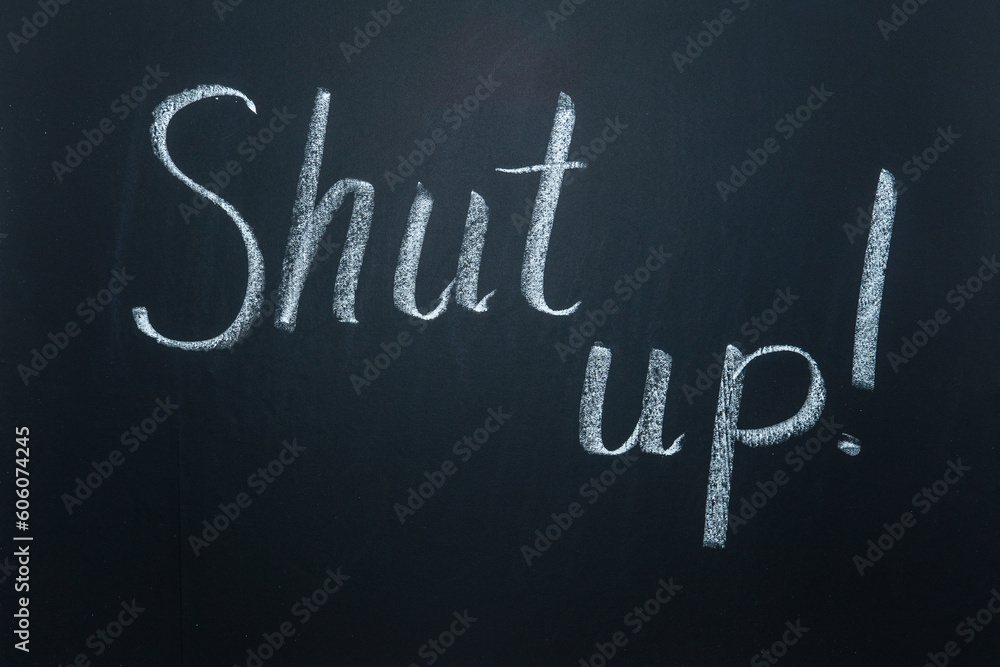 Fototapeta premium Inscriptions and phrases in chalk on a blackboard. Shut up.