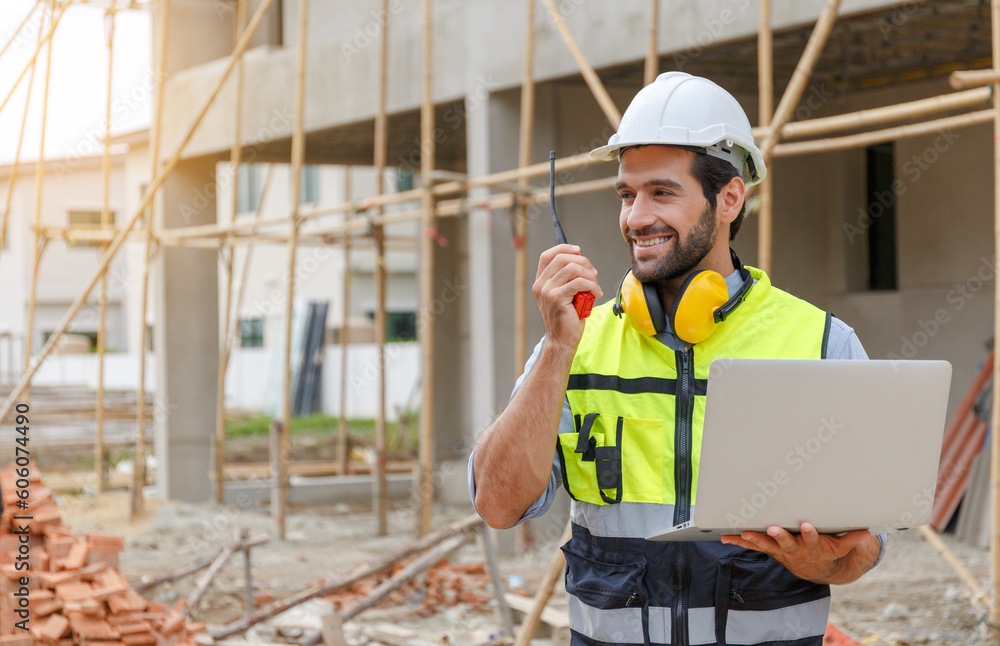Young architect engineering consultant using laptop on construction site inspecting building, inspecting, designing and planning Young architect engineering consultant using laptop on construction site inspecting building, inspecting, designing and planning