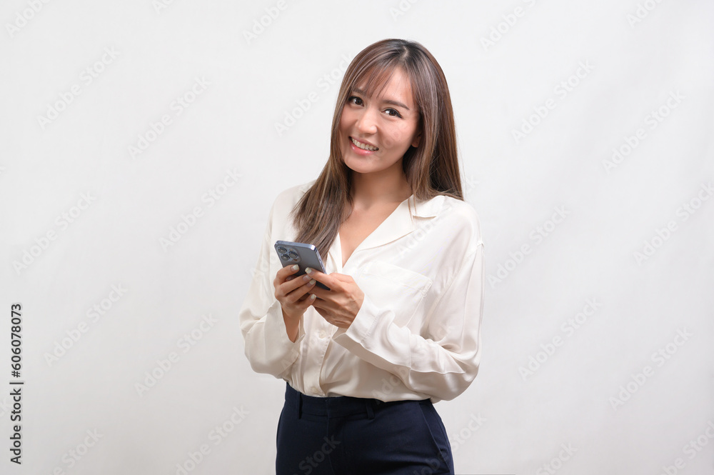 Young asian woman using smartphone over white background, technology concept. Young asian woman using smartphone over white background, technology concept.