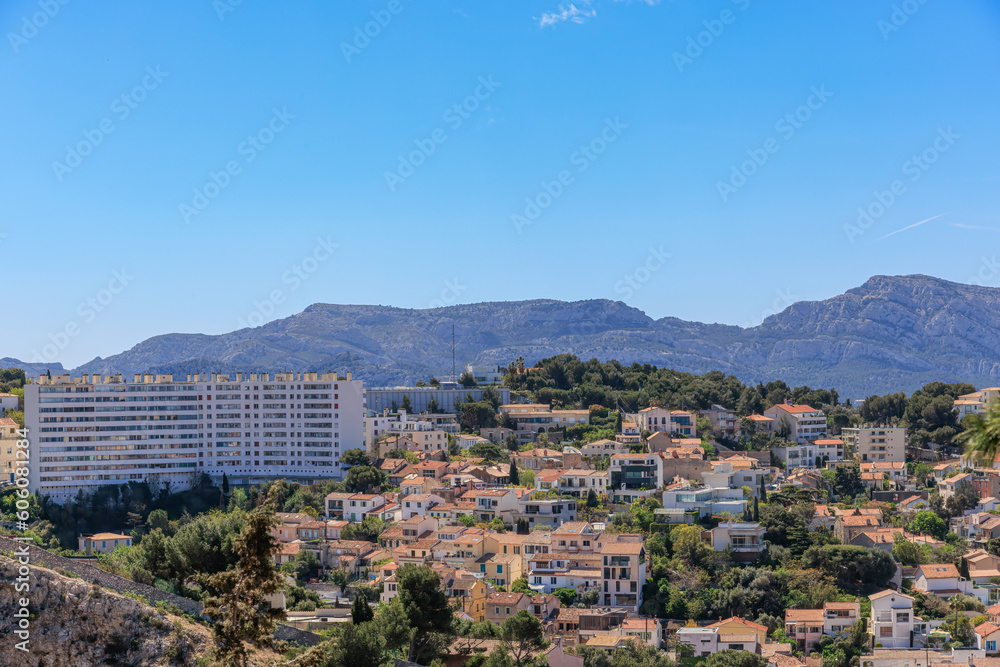 A scenics aerial view of the city of Marseille, bouches-du-rhône, France under a majestic blue sky and some white clouds