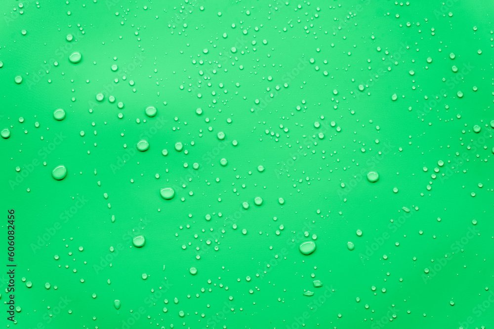 Water or rain drops on green background 