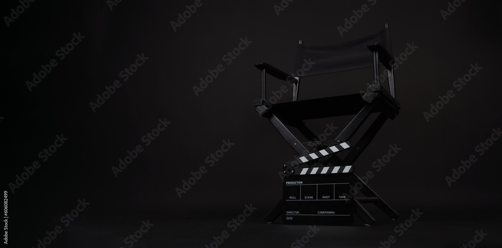 Director chair and clapper board on black background