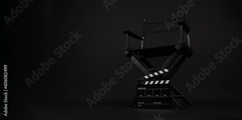 Director chair and clapper board on black background © nisara