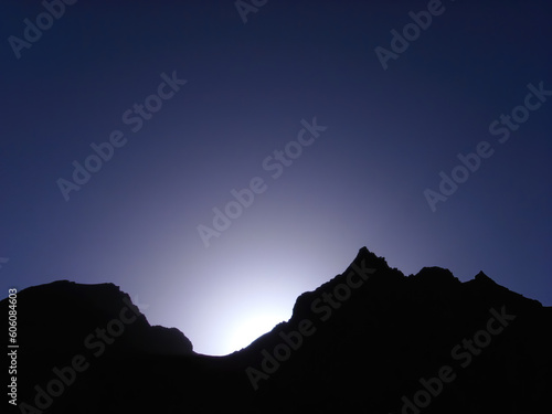 Canvas Print Sunrise on a blue mountain silhouette background