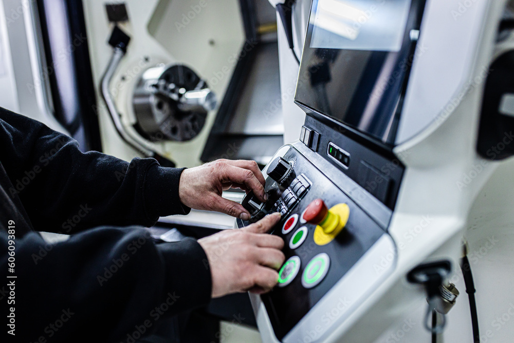 Close up man hand operating with CNC machine. Close up man hand operating with CNC machine.