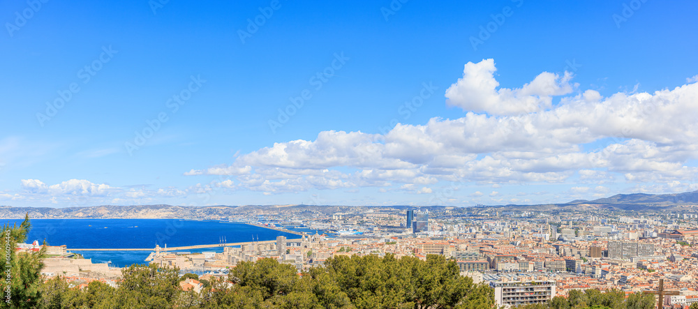 A scenics aerial view of the city of Marseille, bouches-du-rhône, France under a majestic blue sky and some white clouds