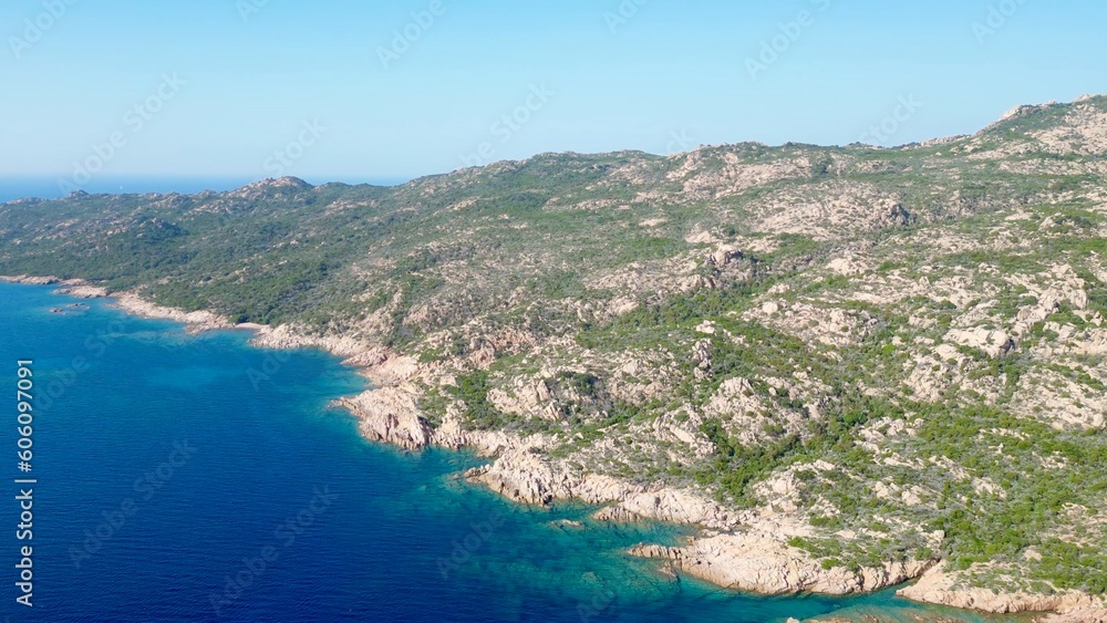 Sweeping Serenity: Over Bonifacio's Mount of the Trinity, Corsica - A Drone's Odyssey from Rocky Shores to Crystal-Blue Expanse under the Radiant Sun