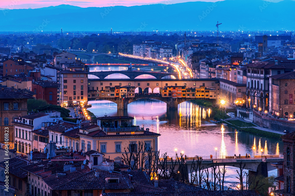 The view of the Ponte Vecchio from Piazza Michelangelo in Florence at sunset.