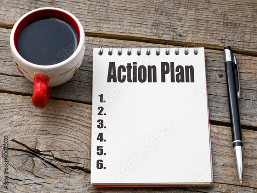 ACTION PLAN words in an office notebook. photo