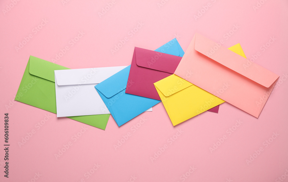 Set of colored envelopes on pink background. Creative layout Set of colored envelopes on pink background. Creative layout