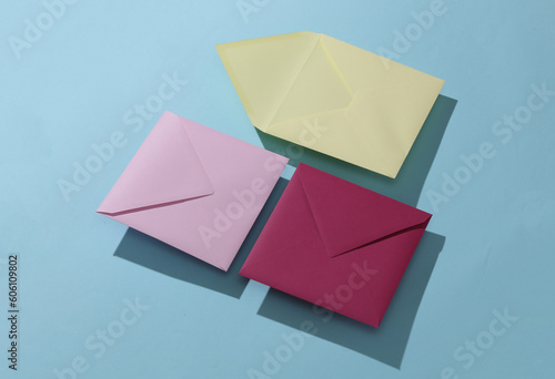 Square colored envelopes on a blue background