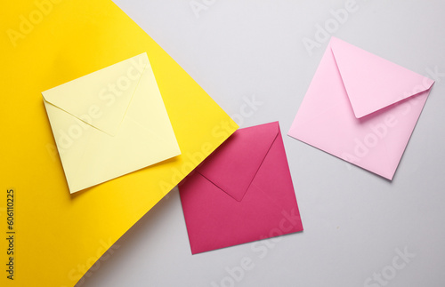 Set of colored envelopes on a yellow gray background