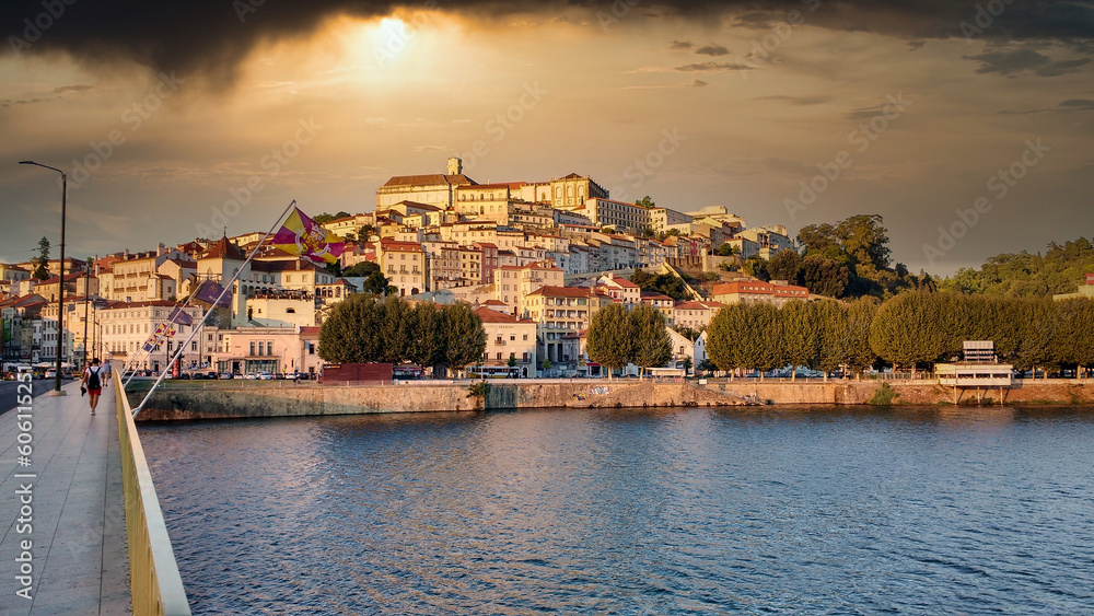 Coimbra city seen from across the Mondego River at sunset, Portugal