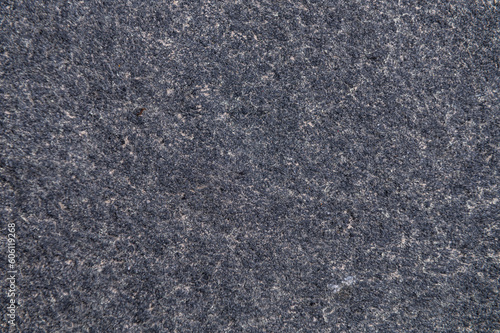 Granite surface as background. Grunge stone texture. Basalt. Rock surface background