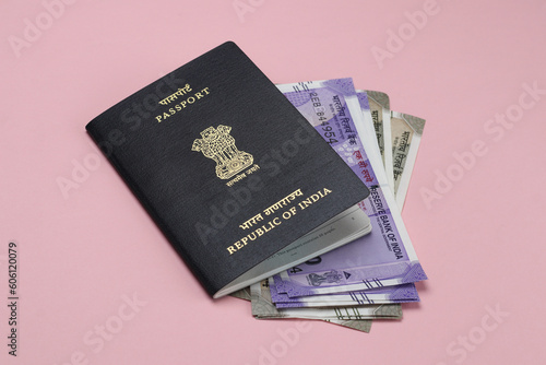 Indian passport and indian currency notes together.