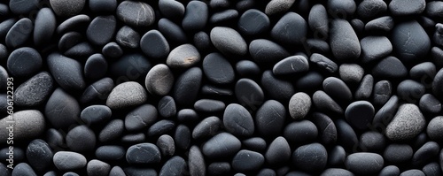 a birds-eye view of Black river stones in a horizontal format for a product backdrop, Abtract-themed, photorealistic illustrations in JPG. Generative AI © Purple Penguin GFX