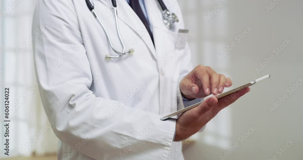 Tablet, healthcare and hands of doctor doing research in a hospital before a consultation. Technology, professional and closeup of male medical worker doing data analysis on mobile in medicare clinic Tablet, healthcare and hands of doctor doing research in a hospital before a consultation. Technology, professional and closeup of male medical worker doing data analysis on mobile in medicare clinic