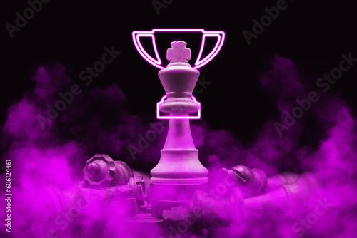 pink violet purple chess king champion over defeated pieces. Led champion trophy cup. World Tournament Champion. Chess led neon pieces
