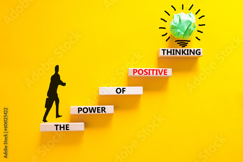 Positive thinking symbol. Concept words The power of positive thinking on wooden block. Beautiful yellow background. Businessman icon. Business, motivational positive thinking concept. Copy space.