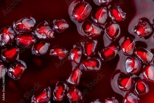 peeled red ripe pomegranate with red sweet grains