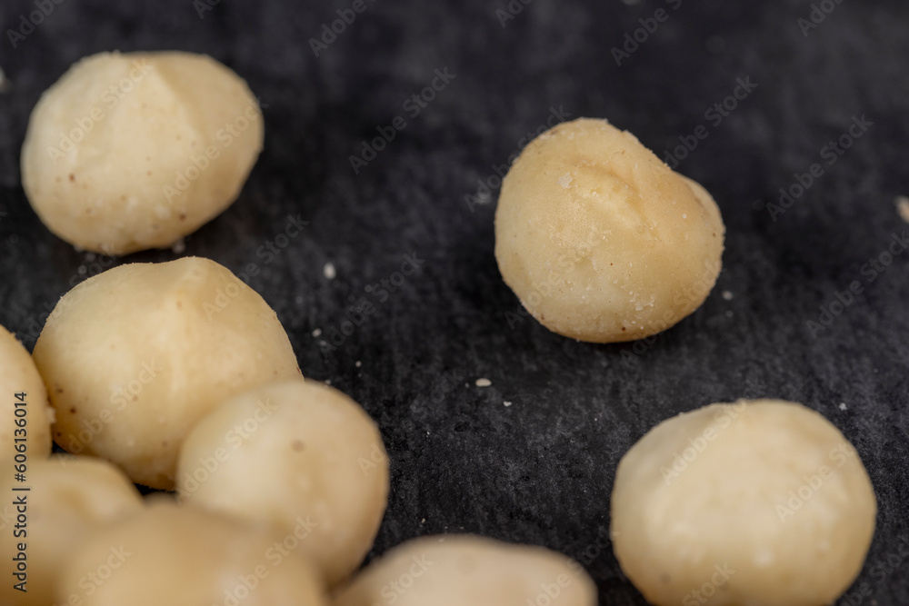 Fototapeta premium Peeled macadamia nuts on the table