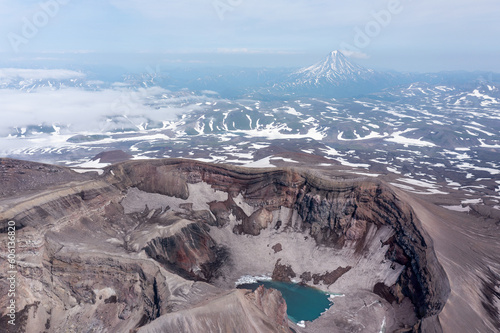The blue lake in the crater of Gorely volcano. Kamchatka Peninsula, Russia photo