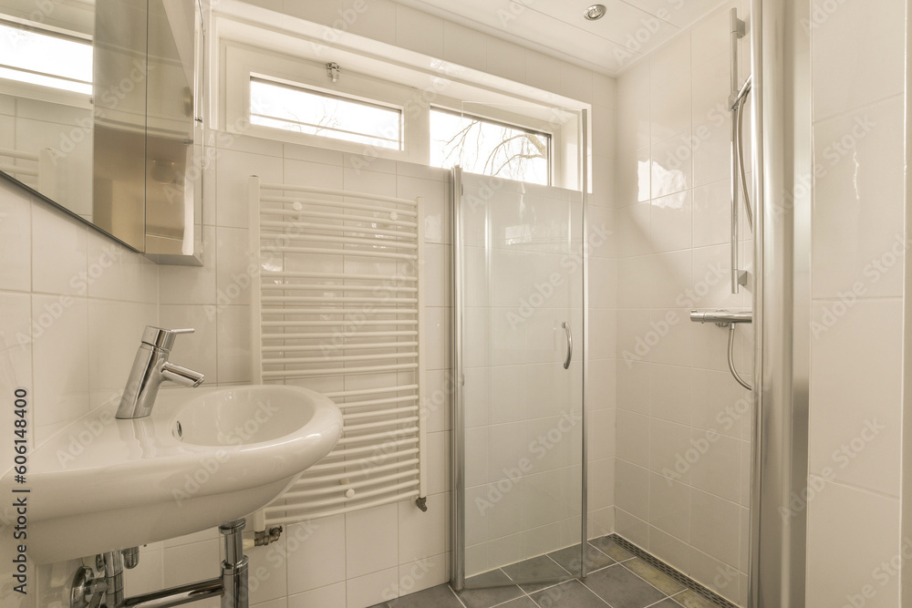a bathroom with a sink, mirror and shower stall in the same room on the left side of the photo a bathroom with a sink, mirror and shower stall in the same room on the left side of the photo