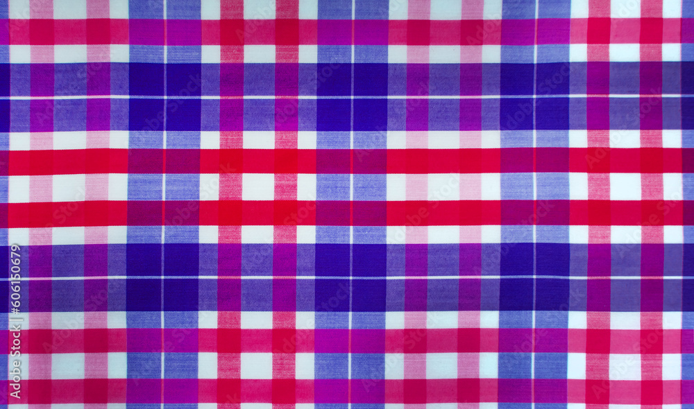 The texture of linen fabric in a large cell of red and blue. Scottish tailoring material The texture of linen fabric in a large cell of red and blue. Scottish tailoring material