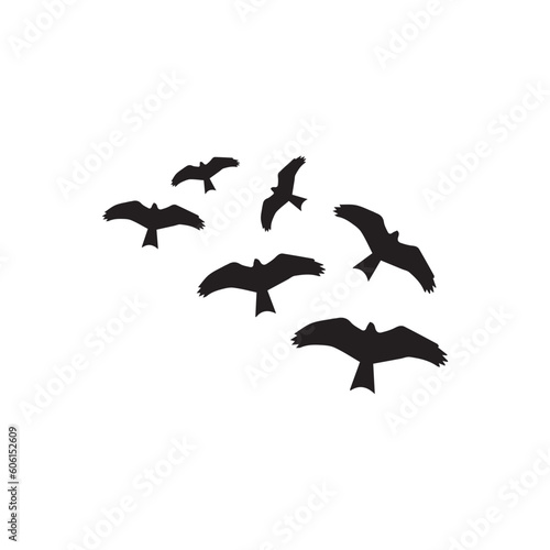 A flock of flying birds silhouette vector art