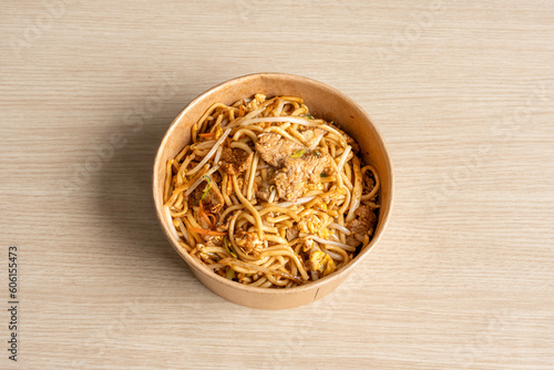 Paris, France - 05 04 2023: Asian dishe culinary Still Life. Thai noodles with beef photo