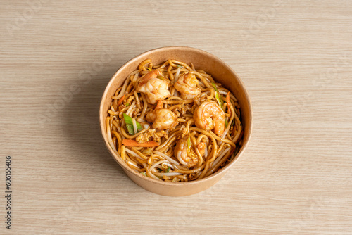 Paris, France - 05 04 2023: Thai dishe culinary Still Life. Thai noodles with shrimps and vegetables. photo