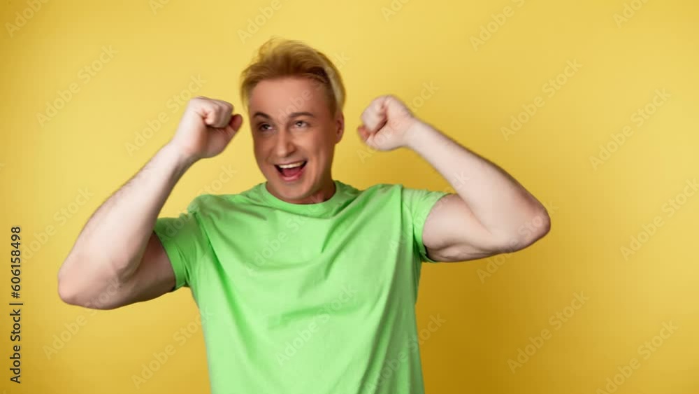 Dance, excited man celebration achievement, success. Freedom, dancing rhythm to music with having fun enjoying guy. Confident, promotion and winner, entertainment concept on yellow background Dance, excited man celebration achievement, success. Freedom, dancing rhythm to music with having fun enjoying guy. Confident, promotion and winner, entertainment concept on yellow background