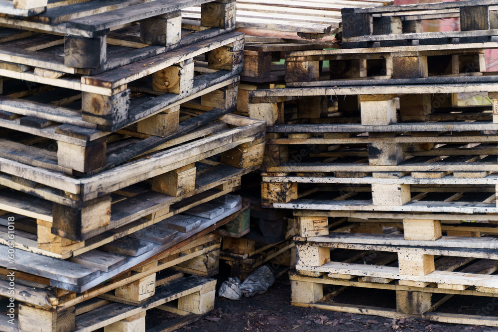 Old wooden pallets stacked on the ground. Old wooden pallets stacked on the ground.