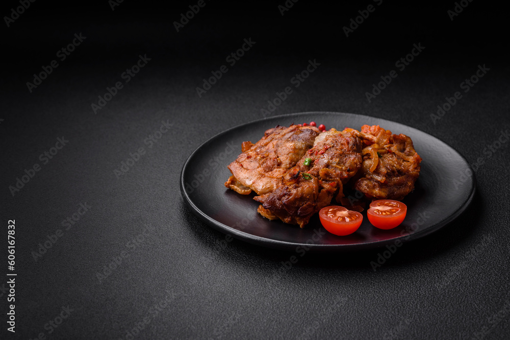 Delicious fried chicken in sauce with onions, salt, spices and herbs Delicious fried chicken in sauce with onions, salt, spices and herbs