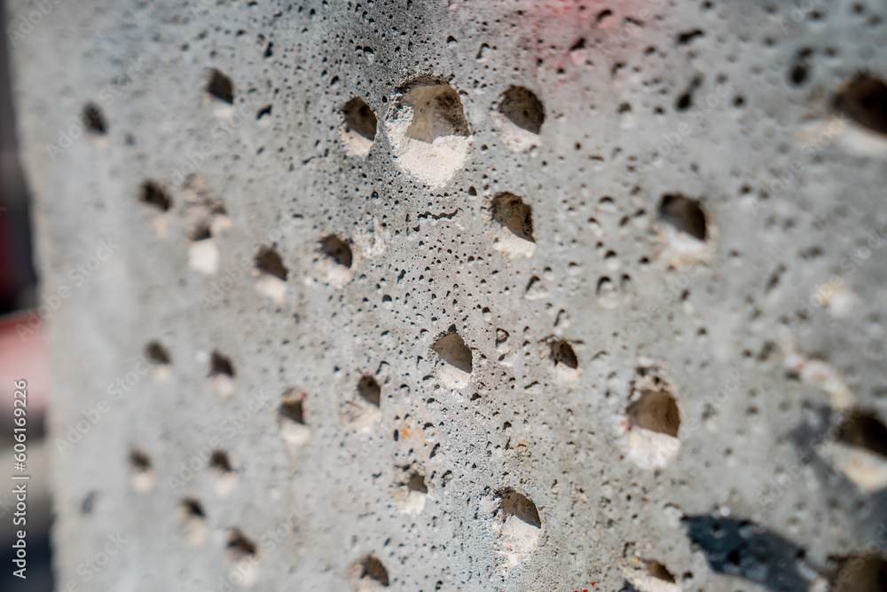 Drilled holes in concrete close up Drilled holes in concrete close up