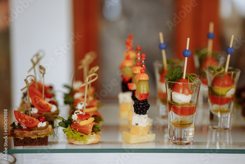 Assortment of elegant and delicious canapes. Bite-sized snacks  stylish and savory little sandwiches.
