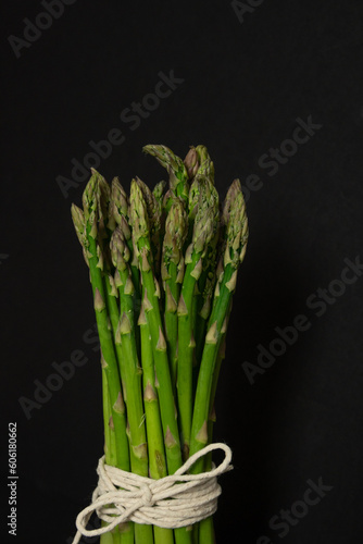 Bunch of asparagus on a black background, spring food, vege diet, eat your greens, from garden