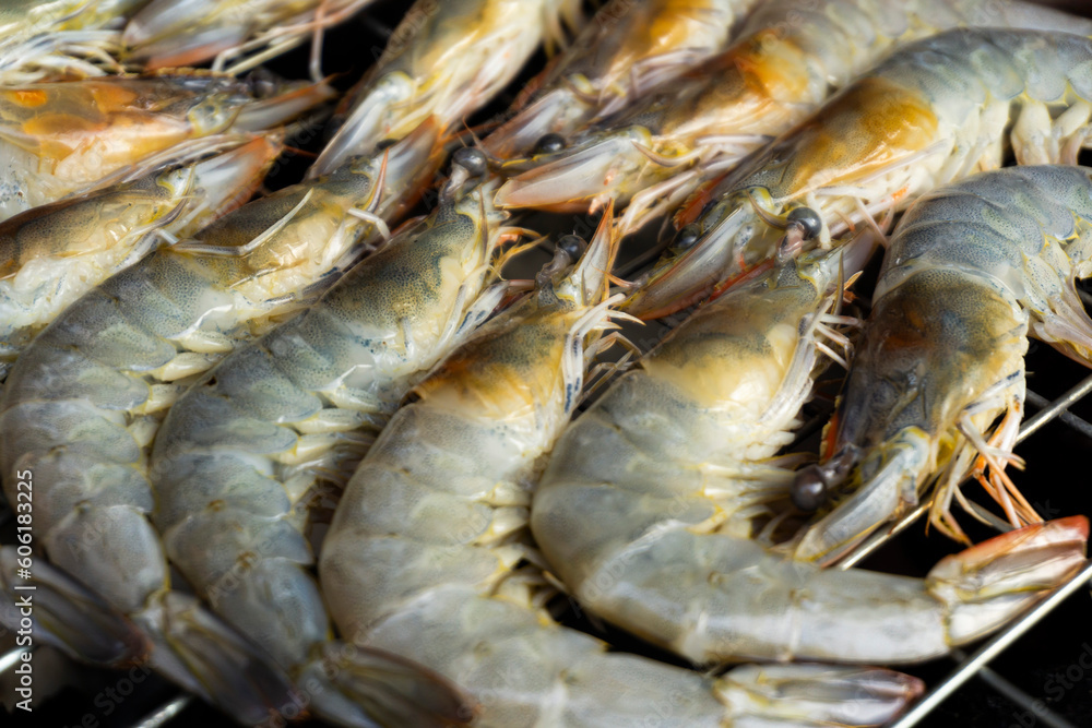 Grilled prawns on a barbecue grill. Close-up. Grilled prawns on a barbecue grill. Close-up.