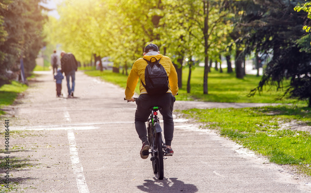 Fototapeta premium Cyclist ride on the bike path in the city Park 