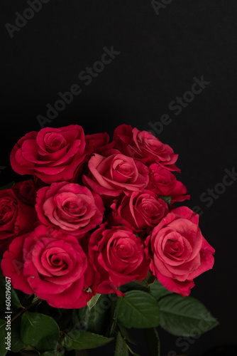 bouquet of pink roses on black background 