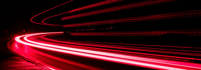 red lines of car lights on black background