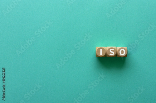 There is wood cube with the word ISO. It is an abbreviation for International Organization for Standardization as eye-catching image.