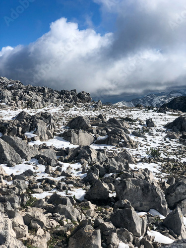 Snow among the stones on the heights of the mountain