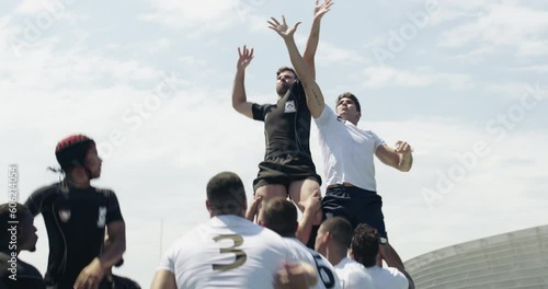 Sports, group of rugby players and play game with catch the ball on the field from a lineout. Competitive match or participation, male athletes or sportsman and sport teams competing for possession